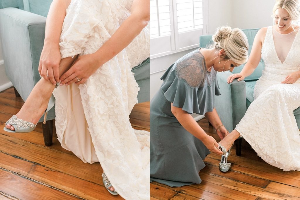 bridesmaid helping bride put on shoes charleston wedding photography