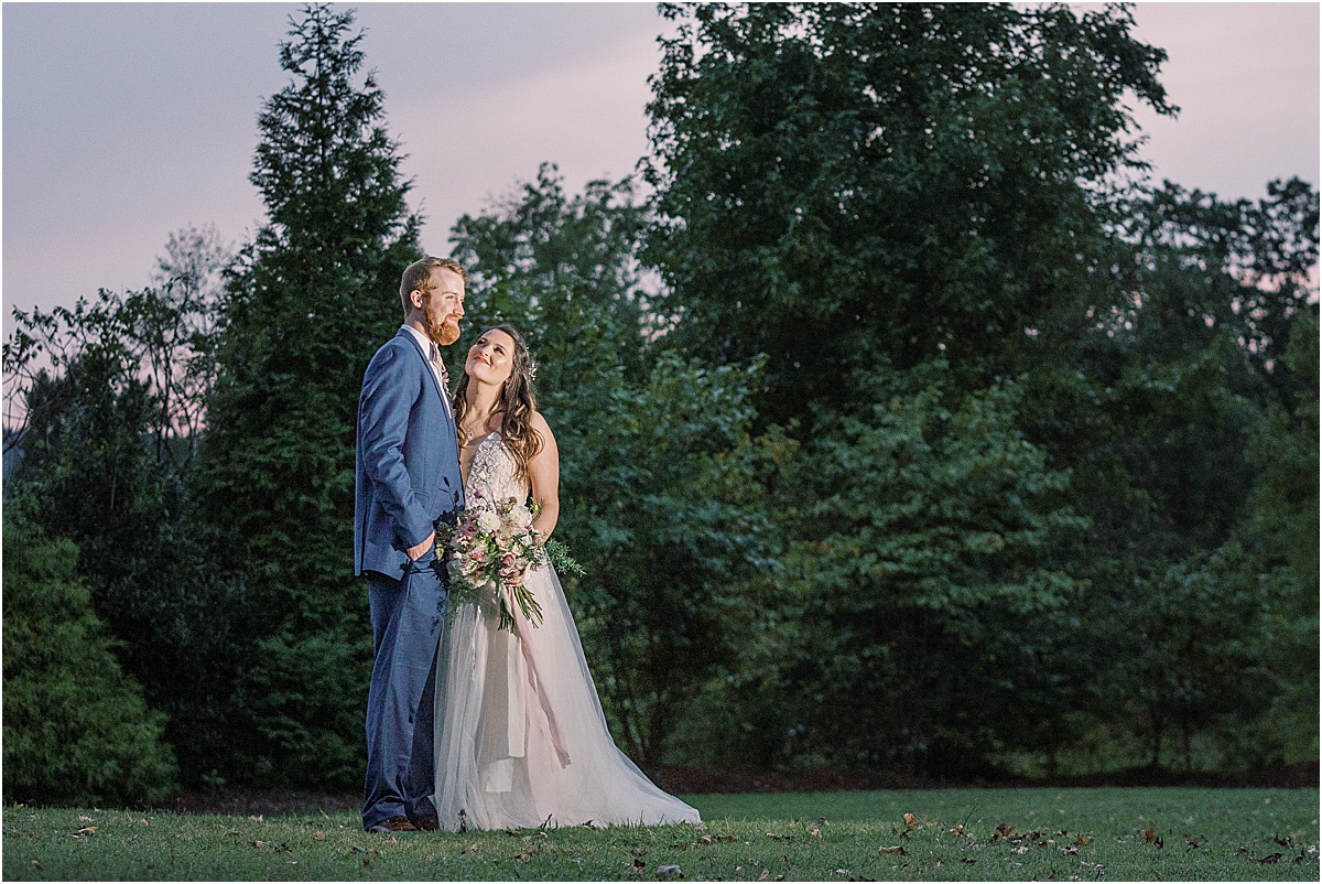 bride and groom with view of mountain tops and colorful sunset in greenville sc wedding viewpoint at buckhorn creek
